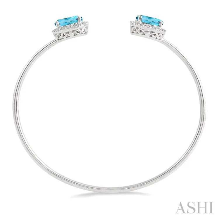 1/10 Ctw Oval Shape 9x7mm Blue Topaz & Round Cut Diamond Bangle in Sterling Silver