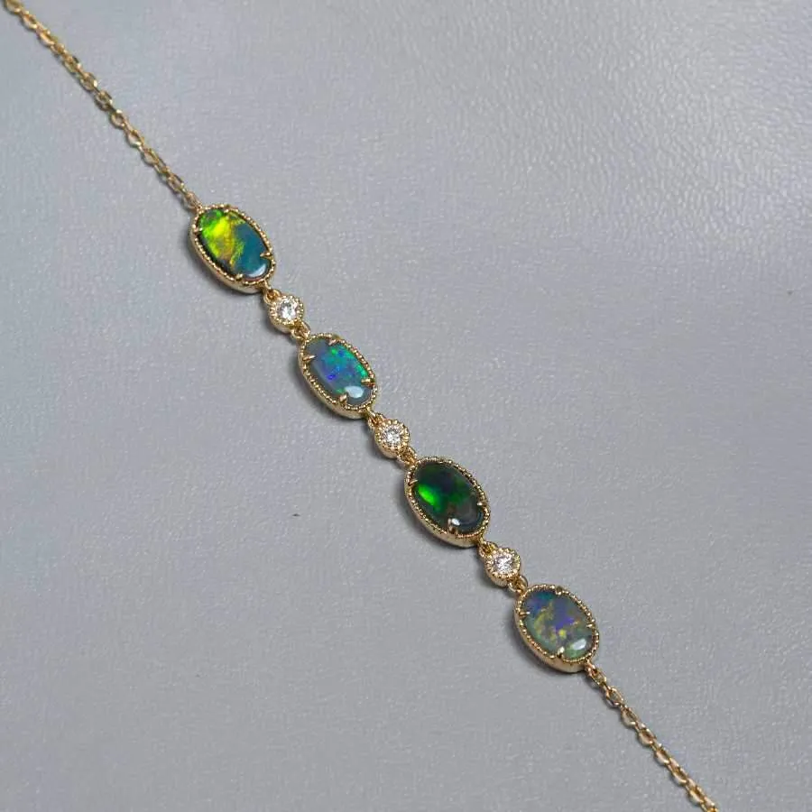 Beautiful Australian Black Opal Diamond Bracelet in 18K Yellow Gold