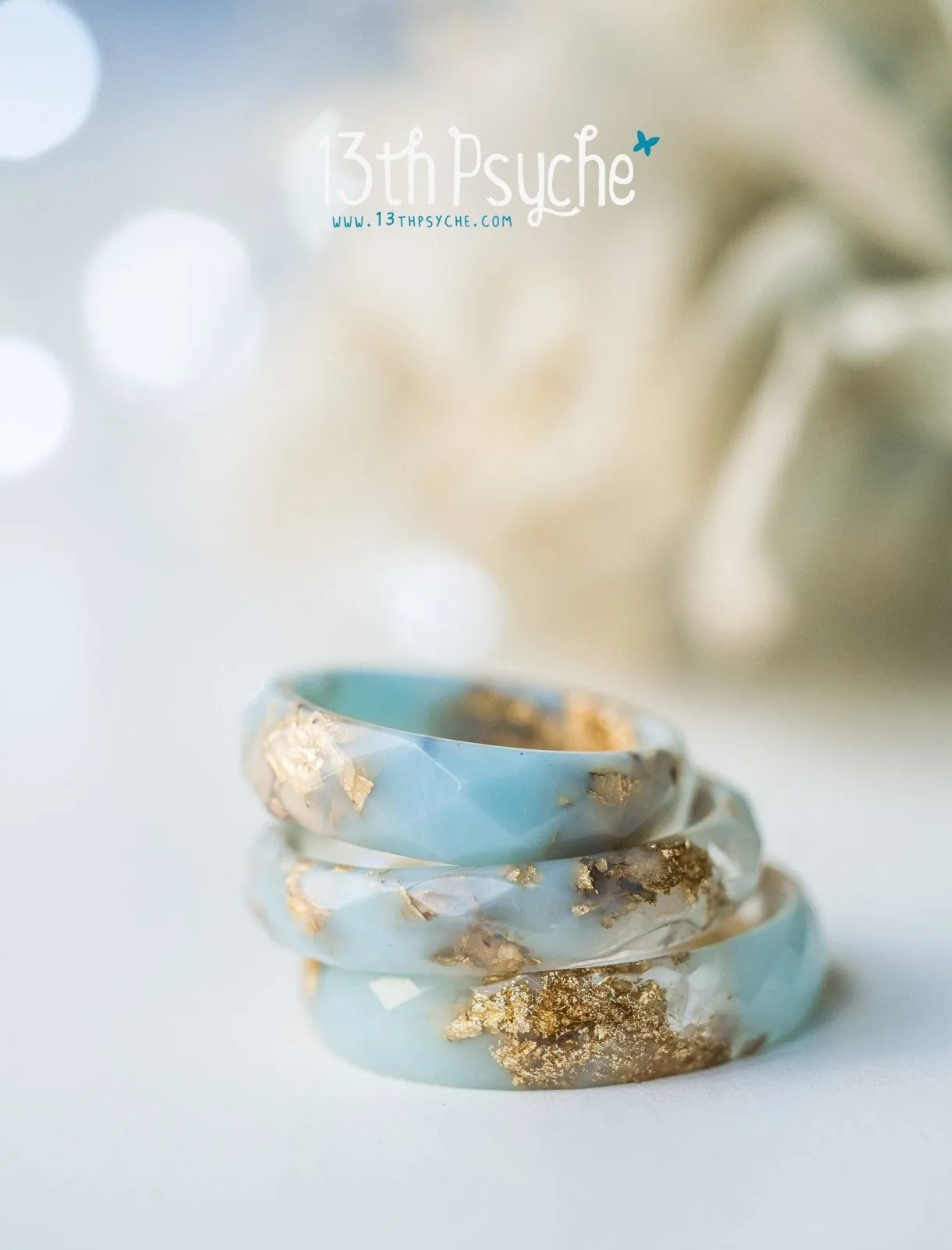 Clear and Pale blue faceted resin ring with gold flakes