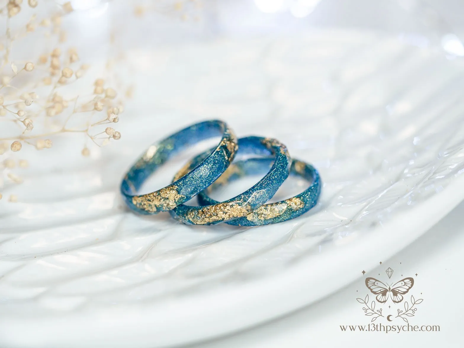 Iridescent blue faceted resin ring with gold metal flakes