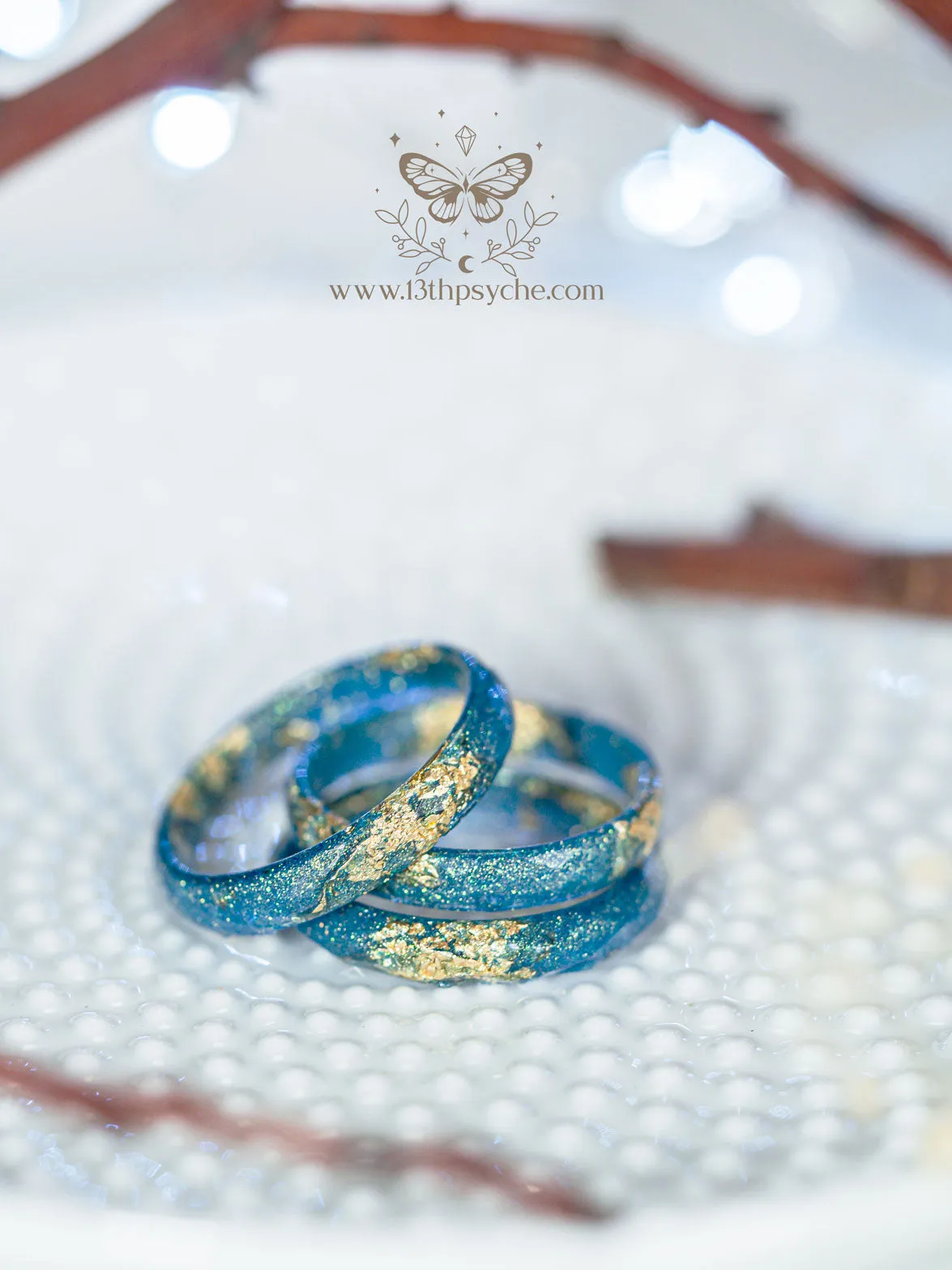 Iridescent blue faceted resin ring with gold metal flakes