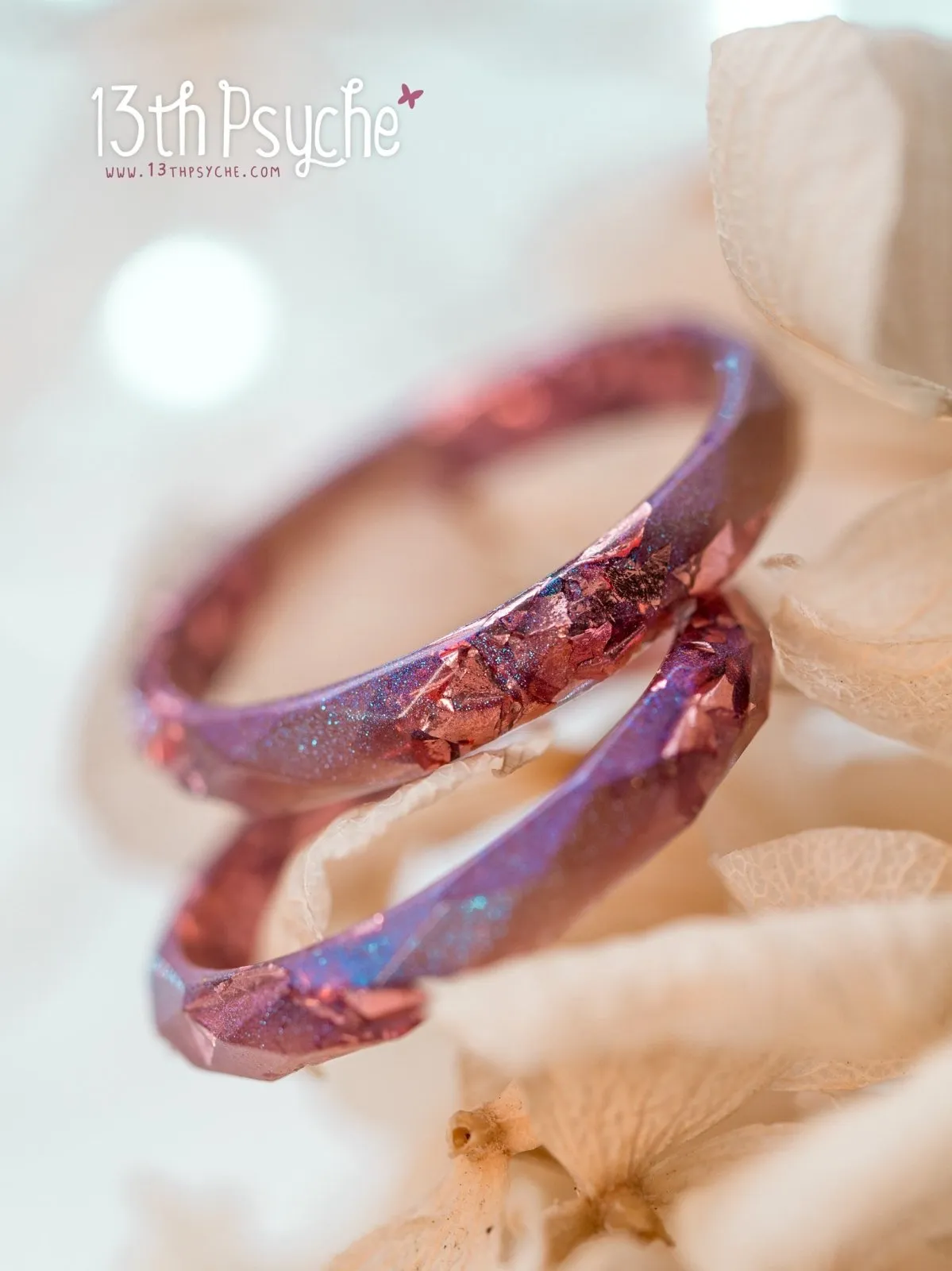 Iridescent pink faceted resin ring with pink metal flakes